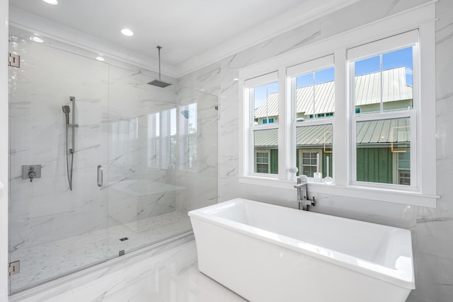 bathroom with ornamental molding and independent shower and bath