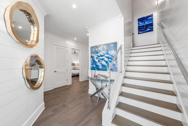 stairs with hardwood / wood-style flooring