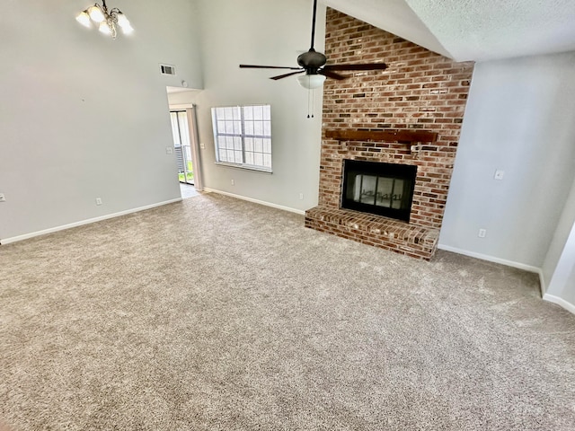 unfurnished living room featuring a textured ceiling, carpet flooring, a brick fireplace, and ceiling fan