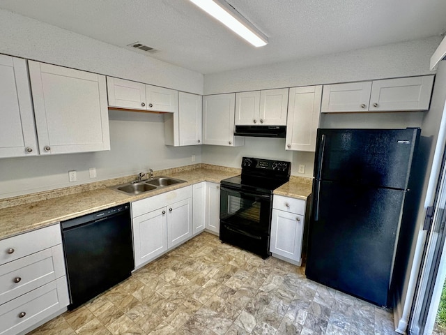 kitchen with white cabinetry, black appliances, and sink