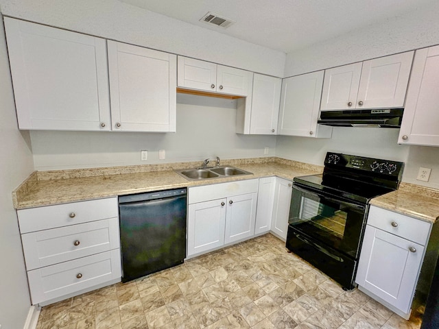 kitchen featuring sink, white cabinetry, black appliances, and light tile patterned floors