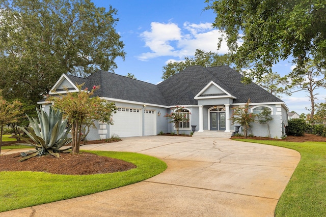 1780 Driftwood Point Rd, Santa Rosa Beach, FL 32459 - view of front of property featuring curved driveway, an attached garage, and a shingled roof