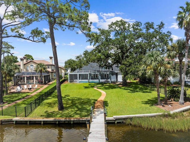 1780 Driftwood Point Rd, Santa Rosa Beach, FL 32459 - view of dock featuring a yard, glass enclosure, a fenced backyard, and a water view