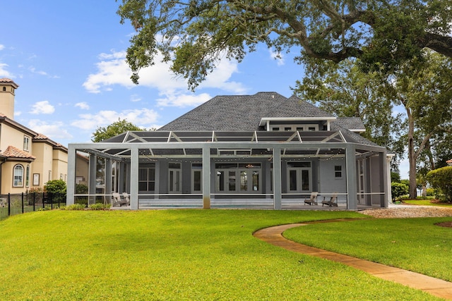 1780 Driftwood Point Rd, Santa Rosa Beach, FL 32459 - back of property featuring glass enclosure, a lawn, and fence