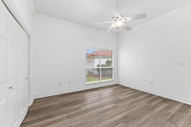 1780 Driftwood Point Rd, Santa Rosa Beach, FL 32459 - unfurnished bedroom with ornamental molding, wood finished floors, a closet, baseboards, and ceiling fan