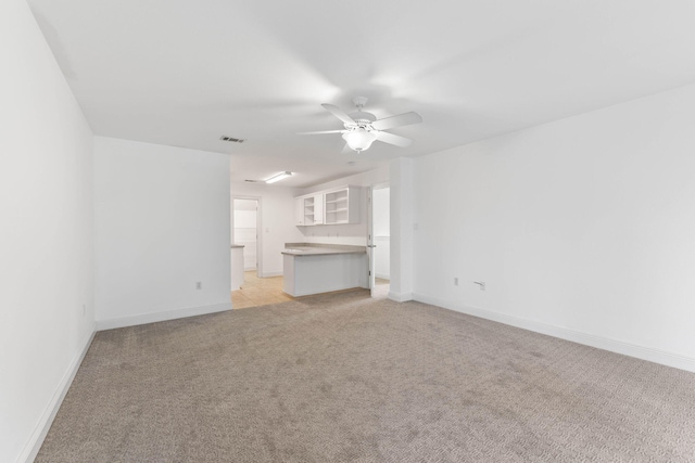 1780 Driftwood Point Rd, Santa Rosa Beach, FL 32459 - unfurnished living room with light colored carpet, a ceiling fan, visible vents, and baseboards