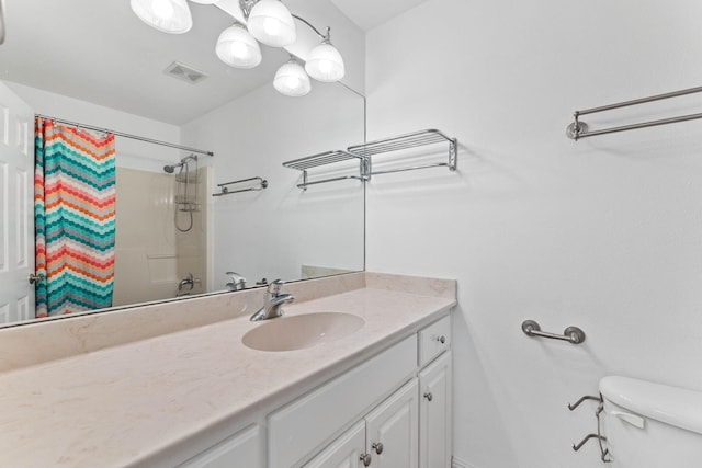 1780 Driftwood Point Rd, Santa Rosa Beach, FL 32459 - full bath with a shower with shower curtain, visible vents, toilet, and vanity