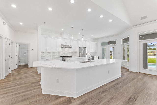 1780 Driftwood Point Rd, Santa Rosa Beach, FL 32459 - kitchen featuring a sink, a large island, under cabinet range hood, appliances with stainless steel finishes, and white cabinetry