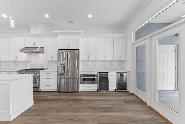 1780 Driftwood Point Rd, Santa Rosa Beach, FL 32459 - kitchen featuring under cabinet range hood, appliances with stainless steel finishes, beverage cooler, and light countertops