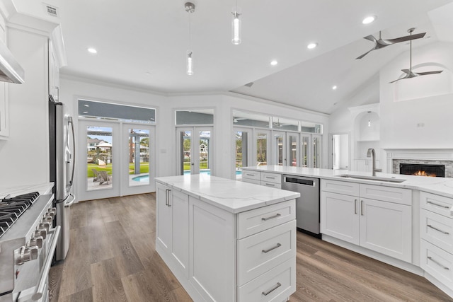 1780 Driftwood Point Rd, Santa Rosa Beach, FL 32459 - kitchen with visible vents, a kitchen island, appliances with stainless steel finishes, french doors, and a sink