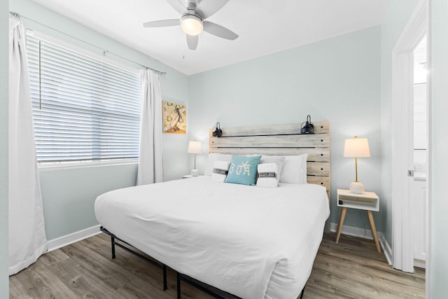 bedroom featuring hardwood / wood-style flooring and ceiling fan