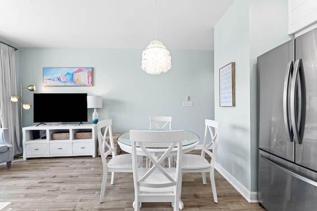 dining space featuring light hardwood / wood-style flooring