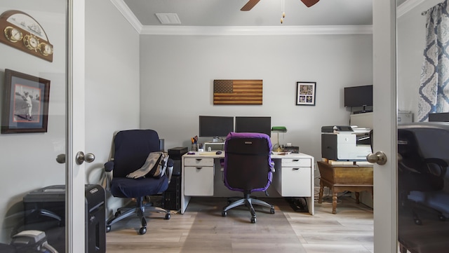 office featuring crown molding, ceiling fan, and light hardwood / wood-style floors