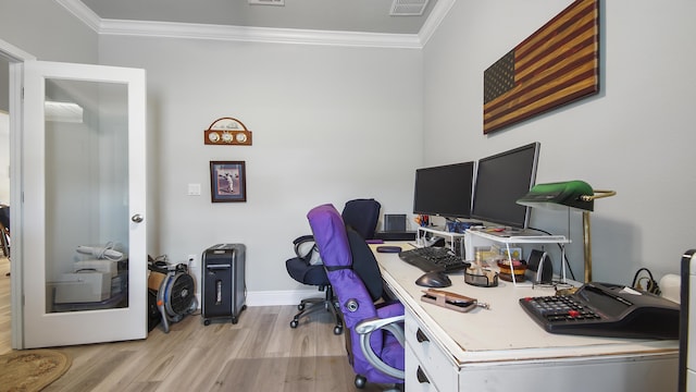 home office featuring crown molding and light hardwood / wood-style floors