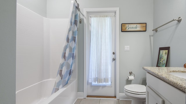 full bathroom with shower / tub combo with curtain, tile patterned floors, toilet, vanity, and a healthy amount of sunlight