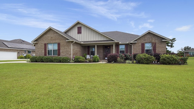 craftsman-style home featuring a front lawn