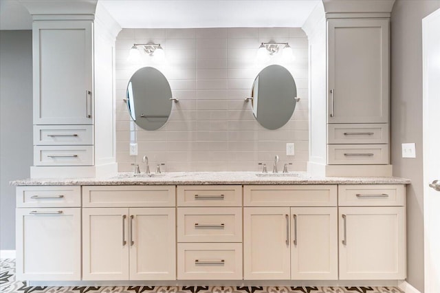 bathroom with vanity and decorative backsplash