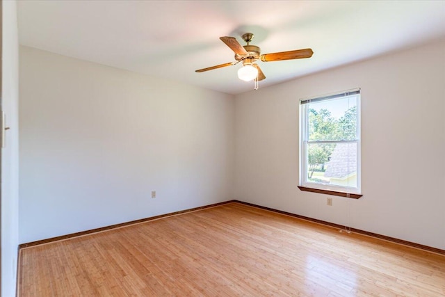 empty room featuring light hardwood / wood-style flooring and ceiling fan