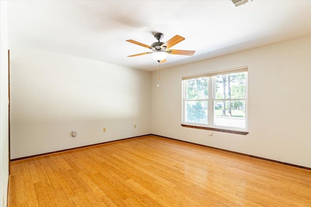 spare room with light hardwood / wood-style flooring and ceiling fan