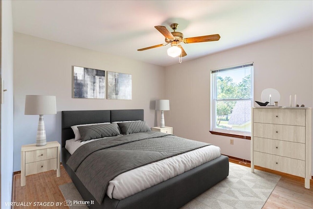 bedroom featuring ceiling fan and light wood-type flooring