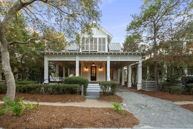 view of front of home with a carport