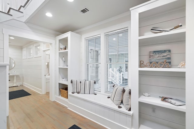 bathroom featuring crown molding and wood-type flooring