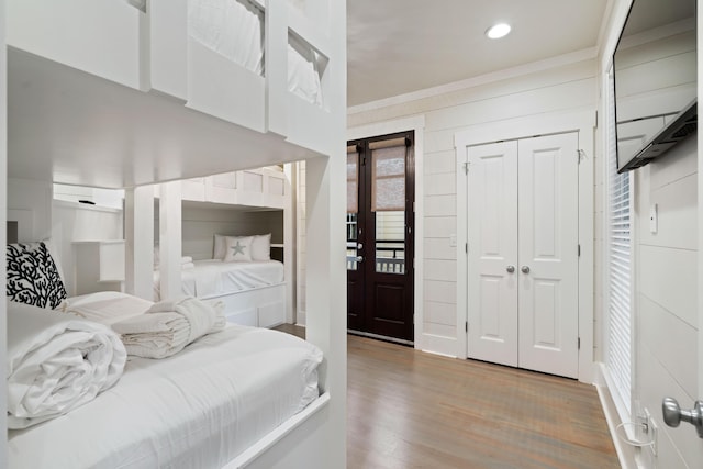 bedroom featuring hardwood / wood-style flooring and a closet