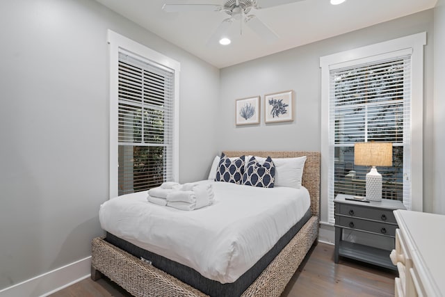 bedroom featuring ceiling fan and dark hardwood / wood-style floors