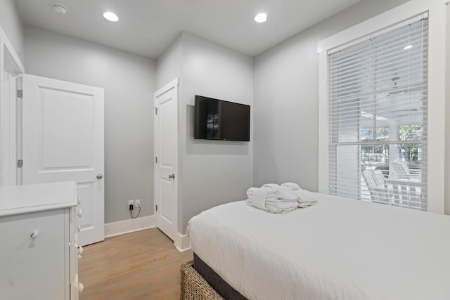 bedroom with light hardwood / wood-style flooring