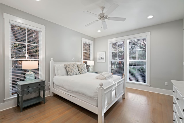 bedroom with hardwood / wood-style floors and ceiling fan