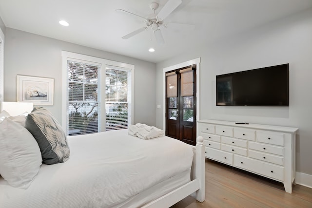 bedroom featuring ceiling fan and light wood-type flooring