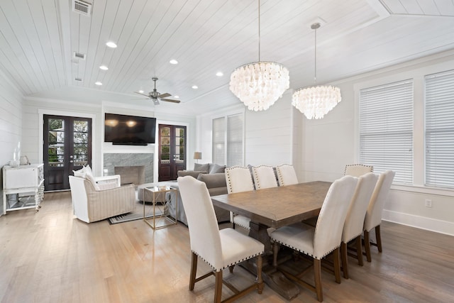 dining space featuring hardwood / wood-style flooring, wooden ceiling, and french doors