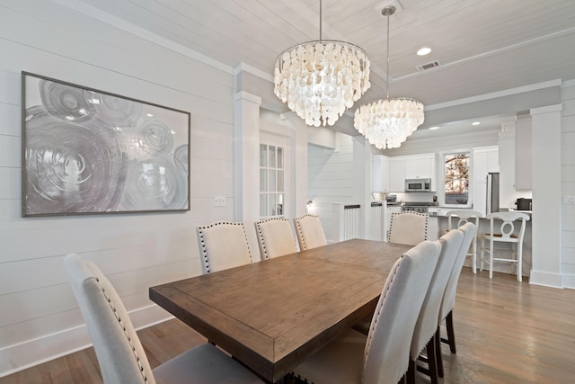 dining space with an inviting chandelier, wooden ceiling, dark hardwood / wood-style flooring, and crown molding