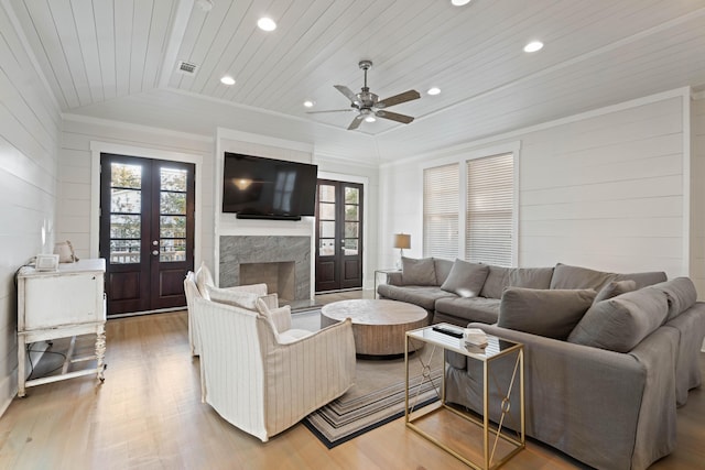 living room with french doors, wood-type flooring, vaulted ceiling, and wooden ceiling