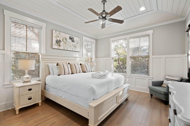 bedroom featuring ornamental molding, ceiling fan, wooden ceiling, and light wood-type flooring