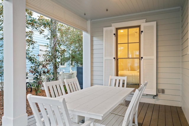 exterior space with wood ceiling and wooden walls