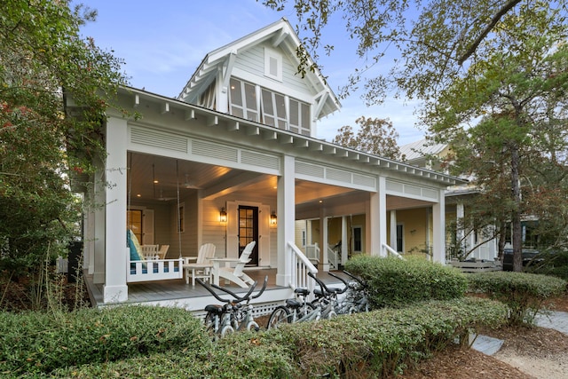 back of house featuring a porch