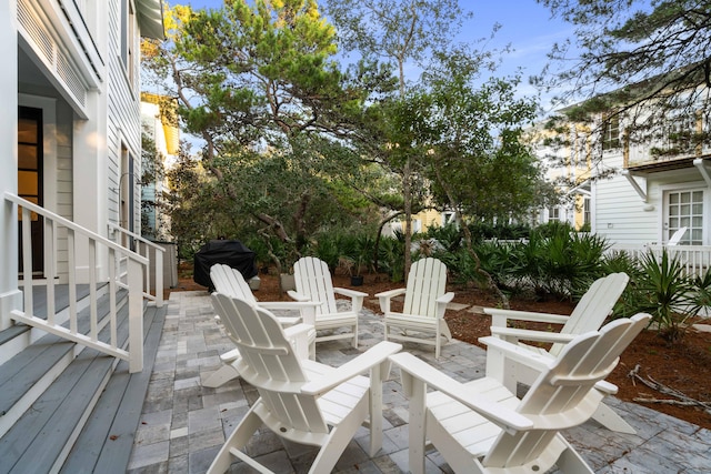 view of patio / terrace with an outdoor fire pit