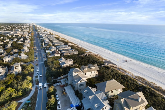 drone / aerial view featuring a water view and a beach view