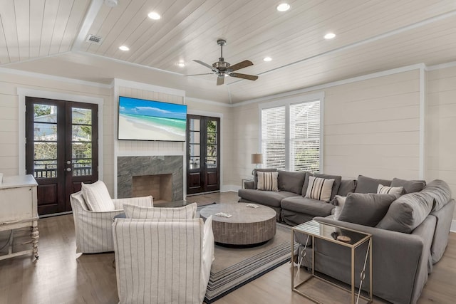 living room with wood-type flooring, vaulted ceiling, wood ceiling, and french doors