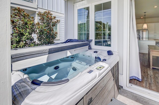 view of patio / terrace with a hot tub