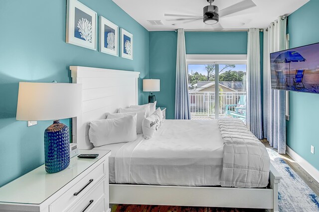 bedroom featuring ceiling fan, access to outside, and hardwood / wood-style flooring