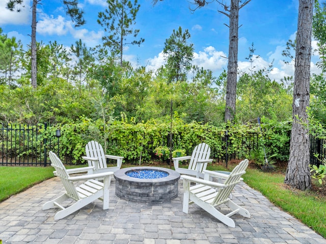 61 Sweet Breeze Dr, Santa Rosa Beach, FL 32459 - view of patio with an outdoor fire pit
