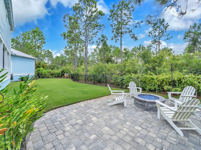 61 Sweet Breeze Dr, Santa Rosa Beach, FL 32459 - view of patio with an outdoor fire pit and view of wooded area