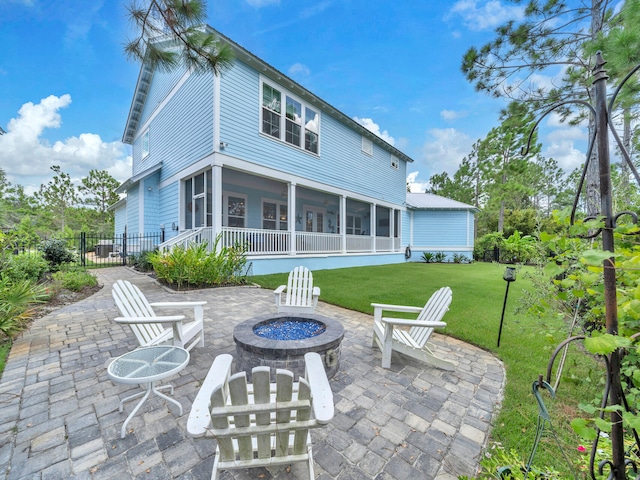 61 Sweet Breeze Dr, Santa Rosa Beach, FL 32459 - back of property with a fire pit, a sunroom, and a patio area
