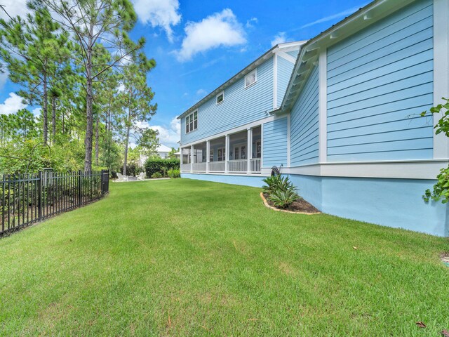 61 Sweet Breeze Dr, Santa Rosa Beach, FL 32459 - back of house with a sunroom