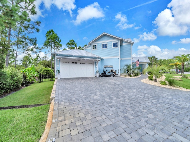 61 Sweet Breeze Dr, Santa Rosa Beach, FL 32459 - view of property exterior with a garage and decorative driveway