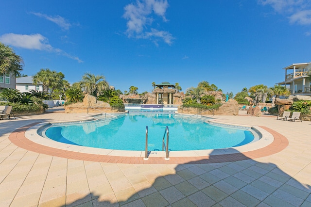 61 Sweet Breeze Dr, Santa Rosa Beach, FL 32459 - community pool featuring a patio area