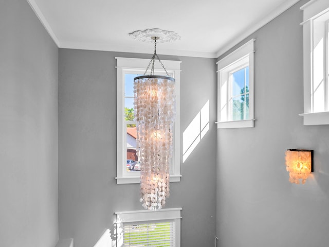61 Sweet Breeze Dr, Santa Rosa Beach, FL 32459 - detailed view of a chandelier and crown molding