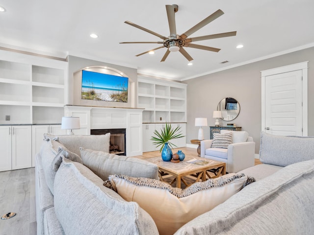 61 Sweet Breeze Dr, Santa Rosa Beach, FL 32459 - living area featuring ceiling fan, ornamental molding, recessed lighting, light wood finished floors, and a fireplace